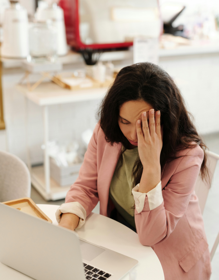 Image showing a person sitting on a couch, feeling down, with a contrast between a "bad week" and signs of clinical depression such as fatigue and isolation.